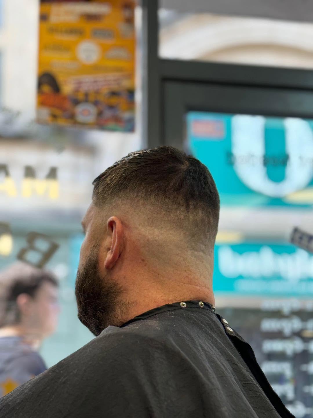 The back of a fresh skin fade blending into a beard, taken in the chair at Marmaris